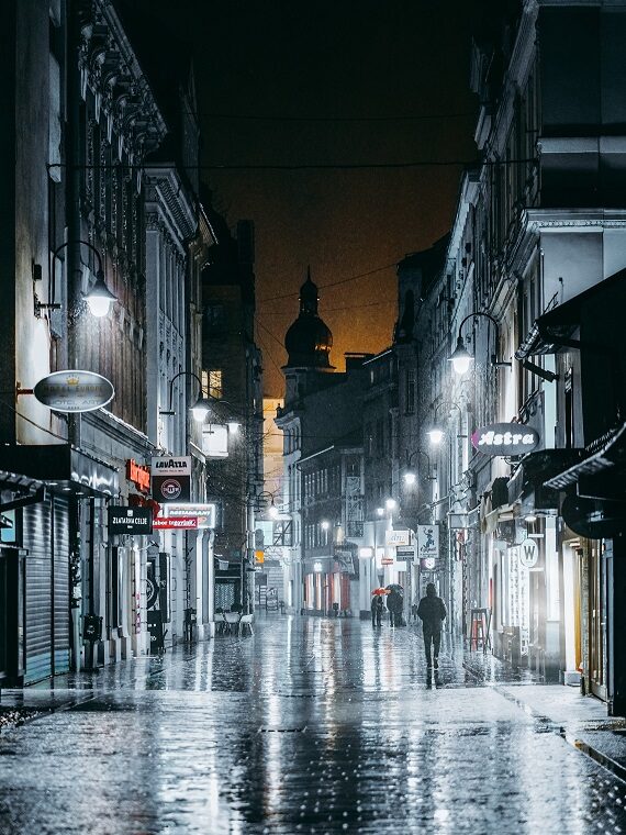 Rain-slicked city street at night
